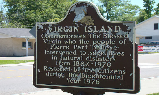 Historical marker of Virgin Island in Pierre Part, located in front of St. Joseph the Worker Catholic Church ... Commemorates The Blessed Virgin who the people of Pierre Part believe intervened to save lives in natural disasters from 1882 - 1976